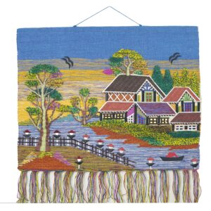 A woven jute wall hanging with a landscape design in multicolor tones.